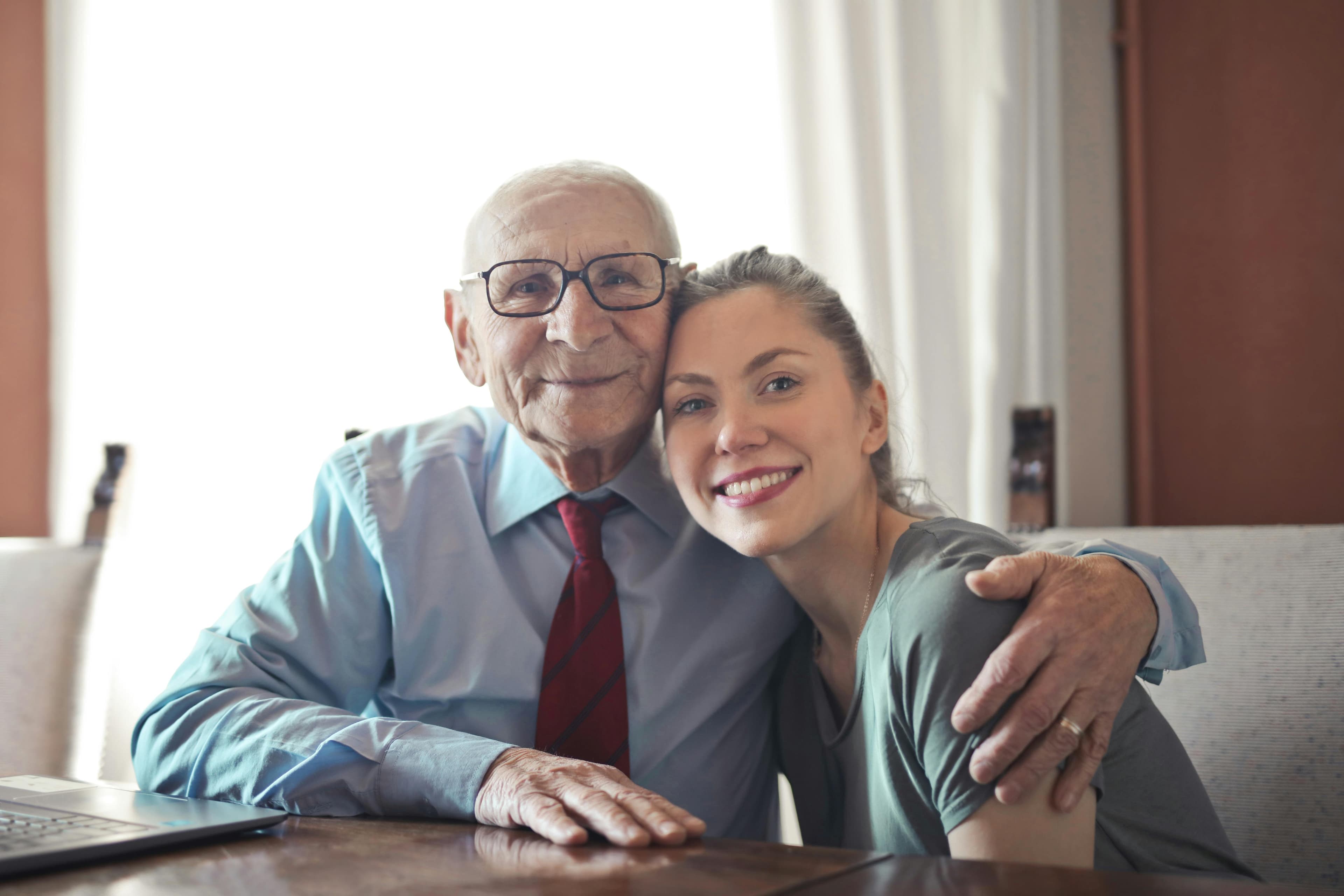 Elderly father with his daughter, smiling together